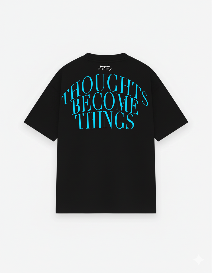 Black t-shirt with blue text 'THOUGHTS BECOME THINGS' on a white background