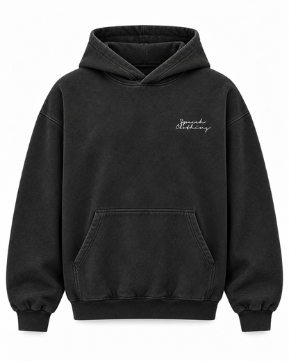 A washed black pullover hoodie with a small white cursive script logo on the left chest, displayed on a clean white background.