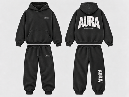 Black hooded sweatshirt and jogger pants set shown from front and back on a light gray background. The front has a small white script logo on the chest, and the back has large white 'AURA' text with smaller text underneath.