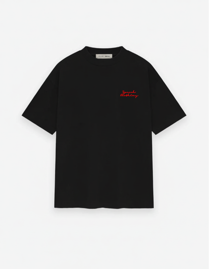 Black t-shirt with red text on a white background