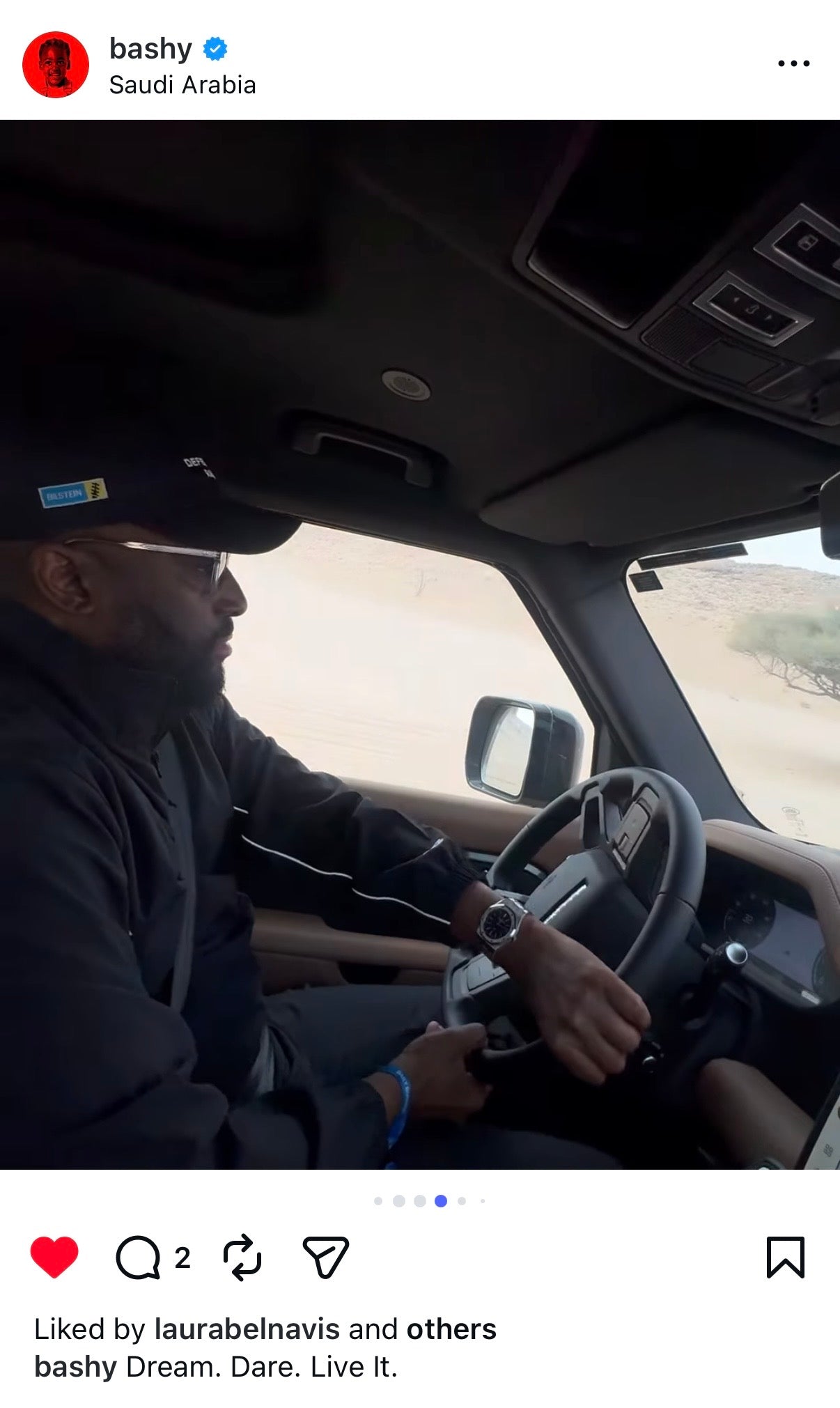 Person driving a vehicle with a scenic background