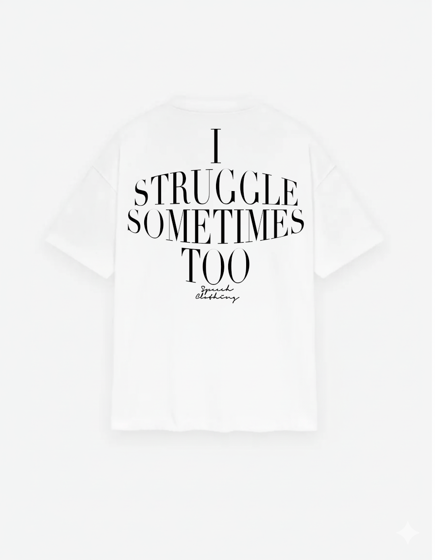 White t-shirt with black text 'I STRUGGLE SOMETIMES TOO' on a white background