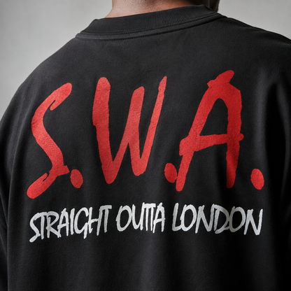 Close-up back view of a person wearing a black crewneck sweatshirt with large red 'S.W.