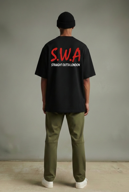Person wearing a black heavyweight t-shirt with 'S.W.A. Straight Outta London' text, standing against a plain background.